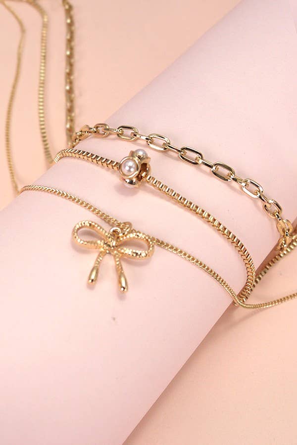 Gold Multi Layer Pearl Bow Charm Necklace